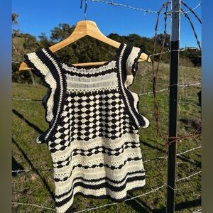 Black and white crocheted short sleeve shirt. Size medium